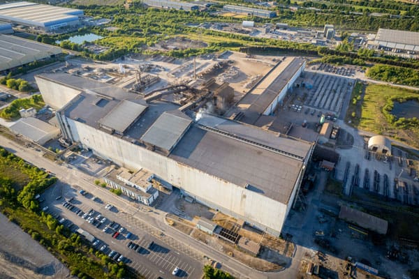 Exterior view of modern industrial factory building with large warehouses